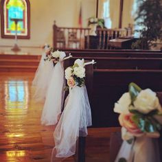 flowers are placed on the pews in a church