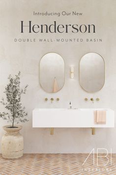 a bathroom with two sinks and mirrors on the wall above it is an advertisement for henderson's double wall - mounted basin