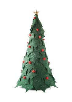 a small green christmas tree with red berries on it's top and star decorations