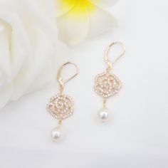 Diamond flower Swarovski pearl earrings. Design and handcraft in our Burlington Studio. ------------------------------------------------------------- PRODUCTS DETAILS Length: 45mm Pearls: 8mm Flower drops: 30X15mm Lever backs: 14K gold filled Flower drops: 14K gold plated imitation opal & cubic zirconia ------------------------------------------------------------- SAME COLLECTION Necklace https://www.etsy.com/ca/listing/1674894946/diamond-floral-swarovski-pearl-necklace?click_key=a674ee83b808ba4838171ce9a6c94186705b2fd9%3A1674894946&click_sum=6de7e59a&ref=shop_home_active_1&frs=1&sts=1 ------------------------------------------------------------- PACKAGE Gift packed: Jewelry box + bow + cleaning cloth + personalized message card (if it's a gift, pls let me know the words you want to write Elegant Rose Gold Flower-shaped Bridal Earrings, Flower-shaped Cubic Zirconia Bridal Earrings, Elegant Gold Flower Earrings For Wedding, Gold Pearl Flower Earrings For Wedding, Pearl Flower-shaped Wedding Jewelry, Formal Bridal Earrings With Pearl Drop In Flower Shape, Rose Gold Flower Earrings For Wedding, Formal Bridal Flower Earrings With Pearl Drop, Formal Flower-shaped Bridal Earrings With Pearl Drop