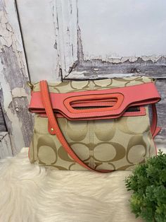 Coach Khaki/Coral Bonnie Fold Over Crossbody Bag 13393. A few marks near top on patent leather and leather, Check photos. Inside is clean with two pocket sleeves and zip comp. Snap closure Goldtone hardware Measures 14”H from top of handle to bottom of bag 12”L Up to 21” adjustable shoulder strap drop Buyer must make payment within two days after purchase. Coach Crossbody Satchel With Adjustable Strap, Coach Crossbody Satchel With Zipper Closure, Coach Shoulder Bag With Removable Pouch For On-the-go, Coach Satchel Shoulder Bag With Zipper, Detachable Handle Crossbody Shoulder Bag, Coach Crossbody Shoulder Bag With Zipper Closure, Coach Crossbody Shoulder Bag, Coach Crossbody Shoulder Bag With Zipper, Coach Shoulder Satchel With Zipper Closure