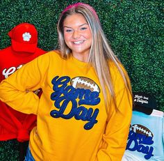 Be ready for game day with this sweatshirt! Featuring black glitter chenille, navy game day, and a football, it's perfect for football season and will match any school colors! So cute and comfortable, you need one of these for game days. Make football season even more fun with this sweatshirt! Unisex sizing and fit Size: Small - 3XL The sweatshirt is available in many different colors SPECIAL CARE - WASHING INSTRUCTIONS: Hand washing and air drying are always best for these items. Wash on delicate, cold, and inside out. Always air dry to prevent lint from sticking to the letters and for longevity of your beautiful items! Team-colored Fan Apparel Sweatshirt For Game Day, Varsity Sweatshirt For Cheerleading In Fall, School Spirit Sweatshirt For Cheerleading In Fall, Fall School Spirit Team-colored Tops, Team-colored Varsity Sweatshirt For Football Season, Team-colored Sweatshirt For Game Day, Collegiate Sweatshirt For Game Day In Fall, School Spirit Sweatshirt For Game Day With Team Name, School Spirit Sweatshirt For Game Day