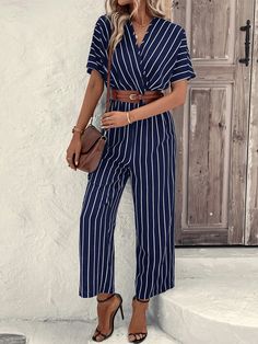 This stylish Striped Print Batwing Sleeve Jumpsuit is perfect for a day out. Featuring a wrap design and long length, it has a striped pattern in blue color that will add a touch of fun to any outfit. With a V-neck, short fluttery batwing sleeves, and a regular fit, this shirt is sure to be a staple in your wardrobe. Specifications: Style: Casual Pattern Type: Striped Details: Wrap Length: Long Type: Shirt Fit Type: Regular Fit Neckline: V neck Sleeve Length: Short Sleeve Sleeve Type: Batwing Sleeve Waist Line: High Waist Fabric: Non-Stretch Material: Woven Fabric Composition: 100% Polyester Care Instructions: Machine wash or professional dry clean Size Chart(cm): Size US Bust Cuff Hip Size Inseam Length Sleeve Length Thigh Waist Size S 4 90 34.5 105 62.5 139 37 67 64-98 M 6 94 35.9 109 63 Striped V-neck Jumpsuits And Rompers For Summer, Trendy Striped Jumpsuits And Rompers For Beach, Striped V-neck Jumpsuits For Vacation, Trendy Striped Jumpsuits And Rompers For Summer, Trendy Striped Jumpsuits And Rompers For Vacation, Spring Beach Jumpsuits With Surplice Neckline, Beach Jumpsuits And Rompers With Surplice Neckline For Spring, Casual Striped Jumpsuits And Rompers For Summer, Striped Jumpsuits For Spring Day Out