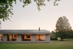 a house that is sitting in the grass