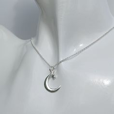 Chic, sophisticated and stylish. Just three ways to describe this gorgeous sterling silver necklace. A perfect addition to any occasion or outfit. It's design features a crescent moon and star, luxuriously polished and available on 4 different chain lengths. The pendant measures 2.3cm x 1.5cm and the necklace comes complete with a gift box. Ready to give,... or keep for yourself Sterling Silver Star And Moon Charm Necklaces, Sterling Silver Charm Necklace With Moon And Star, Sterling Silver Star Charm Necklace With Moon Charm, Silver Crescent Sterling Silver Charm Necklace, Elegant Moon Shaped Sterling Silver Charm Necklace, Elegant Sterling Silver Crescent Charm Necklace, Silver Crescent Charm Necklace With Star, Crescent Sterling Silver Necklace With Star Charm, Sterling Silver Moon Shaped Necklace With Star Charm