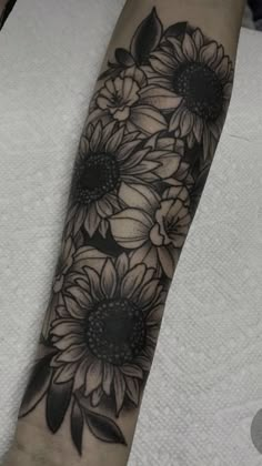 black and white sunflowers tattoo on the left inner arm, done by me