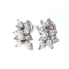 These sparkling Pear & Marquise Diamond Cluster Stud Earrings are crafted in shimmering platinum. A collection of marquise and pear cut diamonds are set in a unique floral motif. The diamonds weigh a total of 7.90 carats. These diamond studs would make terrific jewelry for a wedding or formal event. Finished in durable platinum. Modern Jewelry with a timeless diamond design! Luxury Marquise Platinum Diamond Earrings, Formal White Gold Marquise Cluster Earrings, Formal Marquise White Gold Cluster Earrings, Marquise Single Cut Diamond Earrings For Formal Occasions, Marquise Single Cut Diamond Earrings For Formal Events, Formal Marquise Cluster Earrings In White Gold, Bridal Marquise Diamond Earrings With Brilliant Cut, Formal Diamond Marquise Bridal Earrings, Formal Marquise Platinum Earrings