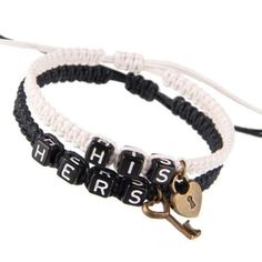 two bracelets with keys and words on them