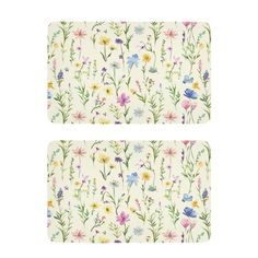 two placemats with flowers on them, one in white and the other in blue