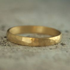 3mm Gold Hammered Ring 18K Gold Hammered Band Half Round Ring Gold Wedding Band Rustic Gold Wedding Ring Hammered Matte Ring Men's Women's A lovely weight band, it begins with 3mm wide by 1.5mm thick solid 18K gold stock. Your ring is hand forged to size just for you and given a hand hammered surface texture. It is then softly brushed for a matte look. Blazer Arts is a family-owned and operated small but growing business that first opened up shop on Etsy in 2008. We now have multiple Etsy shops. Rustic Gold Wedding, Ring Gold Wedding, Rustic Wedding Bands, Hammered Wedding Bands, Rustic Wedding Rings, Growing Business, Wedding Rings Photos, Gold Stock, Hammered Ring