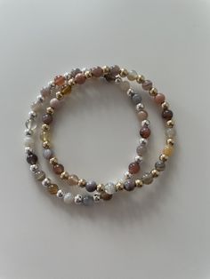 This Botswana Agate bracelet is the perfect neutral addition to any bracelet stack! Botswana Agate is a variety of chalcedony, known for its mesmerizing patterns and unique coloration of brown, grey, pink, orange and purple. Each bead in this bracelet showcases the stone's characteristic banding, creating a distinct and eye-catching look. The 4mm size of the beads strikes a perfect balance between delicacy and presence, making it suitable for everyday wear or special occasions. The bracelet is e Elegant Brown Agate Bracelets, Everyday Hand-strung Agate Beaded Bracelets, Everyday Beaded Agate Bracelets, Everyday Agate Beaded Bracelets, Everyday Agate Bracelets With Natural Stones, Everyday Agate Hand-strung Bracelets, Everyday Agate Beaded Bracelet, Everyday Natural Stone Agate Bracelets, Everyday Hand-strung Agate Bracelets