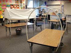 an image of a classroom setting with desks and chairs in the middle, one is empty