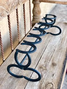 a bench that has some metal letters on it