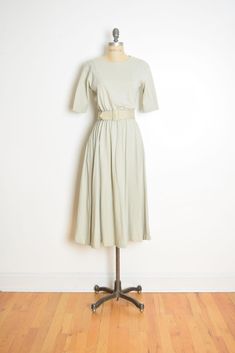 Description: This is a cool vintage maxi dress from the 90s. It's made of heavy-weight knit jersey (100% cotton, unlined) that's khaki-beige in color. This dress has an elastic waist, a matching belt, an extra full skirt, and it closes in back with a zipper. PLEASE NOTE: There's a faint makeup smudge on the side of the skirt. Label: Talbots **Colors in real life may vary a little from the pictures, due to lighting and monitor differences**   Measurements: This dress fits like a size medium, but Makeup Smudge, Modest Midi Dress, Vintage 90s Dress, 90s Dress, Vintage Maxi Dress, Cool Vintage, Full Skirt, Dress Clothes For Women, Vintage 90s