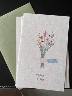 three cards with flowers on them are sitting next to each other, one has the words happy b day