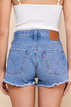 Warm weather is here and it is time to show off those sweet stems in the Levi's 501 Original High-Rise Medium Wash Distressed Denim Shorts! Sturdy cotton denim (in Levi's Athens wash) shapes these cute cutoffs with a classic five-pocket cut, belt loops, branded top button, and a hidden button fly. Light distressing and shredded cut-off hems lend a laid-back vibe! Red logo tag and leather patch at back. Fit: This garment fits true to size. Length: Above mid-thigh. Size 28 Inseam: 2.50 Front Rise: Medium Wash Cotton Jean Shorts For Everyday, Everyday Cotton Jean Shorts With Frayed Hem, Cotton Jean Shorts For Everyday Spring Wear, Cotton Jean Shorts For Spring Everyday Wear, Dark Wash Cutoff Jean Shorts For Everyday, Relaxed Fit Cutoff Jean Shorts For Spring, Relaxed Fit Jean Shorts With Frayed Hem For Everyday, Spring Relaxed Fit Cutoff Jean Shorts, Everyday Denim Blue Cutoff Shorts