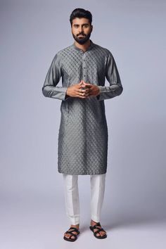 Grey kurta with geometric pattern pintuck details. Comes with pyjama pant.
Components: 2
Pattern: Textured
Type Of Work: Pintucks
Neckline: Mandarin
Sleeve Type: Straight Full
Fabric: Cotton Silk
Color: Grey
Other Details: 
Closure: Front button placket
Occasion: Sangeet - Aza Fashions Grey Kurta, Kurta Set For Men, Vacuum Storage, Indian Wedding Wear, Silk Kurta, Gray Silk, Fashion App, Kurta Designs, Cotton Pyjamas