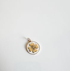 This cute gold and enamel clover pendant is such a cute charm! get her a la carte or on a chain! Yellow Gold Enamel Jewelry With Flower Charm, White Round Pendant Charm Necklace, Yellow Gold Enamel Round Pendant Charm Necklace, Cute Gold Enamel Jewelry, Dainty White Charms For Gift, Dainty White Charms For Gifts, White Dainty Pendant Charm, White Enamel Charm Necklaces, White Enamel Pendant Charm Necklaces