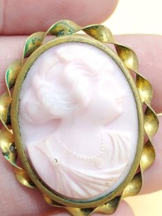 In good vintage condition... old and used NOT new. Brassy tone metal setting with a carved unknown pink cameo. Please look at the pictures for details and condition because the exact item pictured is the exact item that you will receive. Antique Pink Brooch Jewelry, Victorian Pink Brooches For Wedding, Vintage Pink Collectible Brooches, Antique Pink Cameo Jewelry, Cameo Brooch, Bird Brooch, Pearl Pendant, Vintage Gold, Brooch Pin