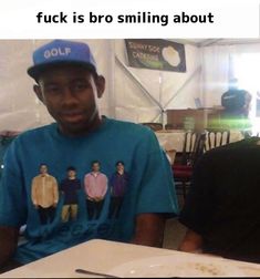 a man sitting in front of a plate of food