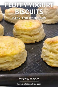 several biscuits on a baking sheet with text overlay that reads fluffyyogurt biscuits easy and delicious