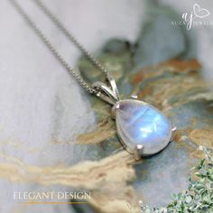 A moonstone silver pendant is a delicate piece of jewelry that combines the ethereal beauty of moonstone with the timeless elegance of sterling silver. The moonstone, known for its pearly sheen and mesmerizing inner glow, is often described as having a moonlit quality. This soft luminescence is caused by a phenomenon called adularescence, which creates a play of light within the gemstone. The silver setting complements the moonstone's subtle brilliance. It can be a simple and modern bezel setting that allows the moonstone to take center stage, or a more intricate design with swirling vines or crescent moon motifs that echo the stone's celestial connection. Moonstone pendants come in a variety of shapes and sizes. Round and oval cuts are classic choices, while pear or teardrop shapes add a Formal Moon Phase Sterling Silver Jewelry, Elegant Silver Moon Jewelry, Elegant Silver Moon-shaped Jewelry, Fine Jewelry Moonstone Birthstone, Fine Jewelry Birthstone Moonstone, Moon-shaped Moonstone Jewelry In White Gold, Elegant Moon-shaped Sterling Silver Jewelry, Elegant Moon Shaped Sterling Silver Necklace, White Gold Moon-shaped Moonstone Jewelry