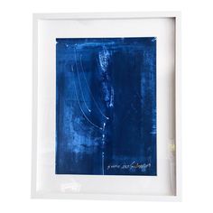 an abstract blue painting in a white frame