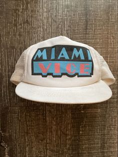 Vintage Miami Vice Snapback Baseball Hat Cap 1980's TV Show w/ Mesh Back. Retro Dad Hat With Curved Brim, Vintage White Baseball Cap With Letter Print, Vintage White Snapback Hat With Letter Print, Vintage White Trucker Hat With Letter Print, Retro White Trucker Hat With Letter Print, Retro Snapback Dad Hat, Vintage Letter Print Snapback Baseball Cap, Retro 5-panel Hat With Letter Print, Vintage Adjustable Trucker Hat With Letter Print