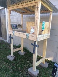 a rabbit house built into the side of a house