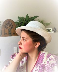 A truly stunning white sunhat, in perfect condition! This piece feels like the perfect summer accessory!  Although probably from the 1960s, this hat can very easily by worn and styled more 1910s 'Downton Abby' as well! Made with a breathable weave and decorated with a pleated sash, this hat truly speaks of garden parties, picnics and Sunday strolls!! White Sunhat, 1950s Summer, 60s Cocktail Dress, Downton Abby, Pillbox Hat, Garden Parties, Summer Hat, Bucket Hats, Big Apple