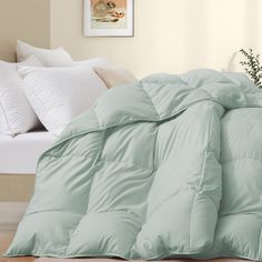 the comforter is made up and ready for someone to use it in their bed