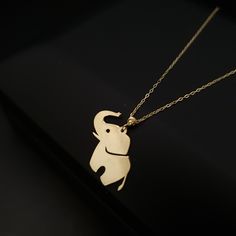 14K Real Gold Baby Elephant Necklace weight: 1.00 gr approximate length: 45.5cm - 18inch PRODUCT CARE * Remove your jewelry before exercising, showering and sleeping. * Avoid exposure to perfumes, lotions and other chemicals. BEST PRICE ON ETSY FOR SOLID 18kGOLD NECKLACES! Premium spring lobster Hook for added safety! Priced to sell! Compare our prices to other similar sellers! Arrives in a GIFT BOX and includes FREE SHIPPING within the USA and Canada. International shipping is available at the most economical rates on ETSY. I HAVE BEEN IN THE JEWELRY BUSINESS ALL MY LIFE. I am a second -generation family member making gold and jewelry. Please feel free to ask me any questions - Always happy to help! We are Shipping with the Best WORLD WIDE SHIPPING COMPANY DHL With INSURANCE Fast Replies Mothers Birthday Gift, Mothers Birthday, Baby Elefant, Animal Pendant, Mother Birthday, Elephant Necklace, Elephant Lover, Mother Birthday Gifts, Gold Baby