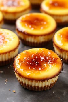 several small desserts are lined up on a baking sheet