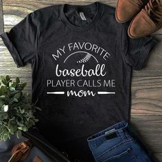 a t - shirt that says, my favorite baseball player calls me mom on it