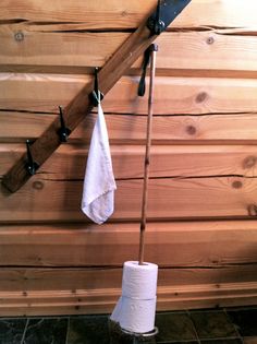 two rolls of toilet paper are hanging on the wall