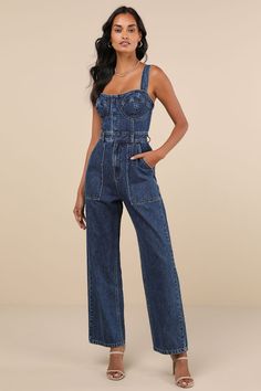 This spring will be full of admirers and compliments with a trendy look like the Lulus Fresh Perfection Dark Wash Bustier Sleeveless Denim Jumpsuit! Slightly acid-washed 100% cotton denim shapes this too-cool jumpsuit that features a bustier-inspired bodice with seamed cups and a sweetheart neckline, supported by wide adjustable tank straps. A hidden snap button placket secures the front of the bodice, atop a banded waist with convenient belt loops and a hidden zip fly. The relaxed, straight pant legs feature front porkchop pockets and back patch pockets, all before finishing at full-length hems. Smocked panel at back for fit. Fit: This garment fits true to size. Length: Floor length. Size medium measures 50.5" from top to bottom. Inseam: 28.75 Front Rise: 11.50 Bust: Great for any cup siz Full Denim Outfit, Bustier Jumpsuit, Jumpsuit Denim, Denim Bustier, Jumpsuit Blue, Short Torso, Long Torso, Gameday Outfit, Relaxed Fit Jeans