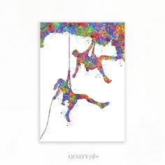 two people are climbing up the side of a cliff with colorful paint splatters