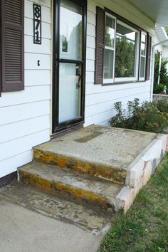 the steps lead up to the front door of a house