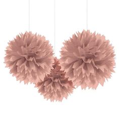 three pink tissue pom poms hanging from strings