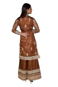 Caramel brown full sleeves A-line kurta with all over persian jaal embroidery using dori, thread and sequin highlights. Paired with a matching fleur embroidered palazzo and a contrasting green scallop border fleur motif embroidered organza dupatta. - Aza Fashions Brown Resham Embroidered Sets For Diwali, Brown Resham Embroidery Sets For Diwali, Brown Sets With Resham Embroidery For Diwali, Elegant Brown Festive Sets, Designer Wear Sets With Resham Embroidery In Brown, Brown Dupatta With Resham Embroidery For Navratri, Brown Designer Wear Sets For Diwali, Festive Brown Lehenga With Traditional Drape, Brown Set With Dupatta For Diwali