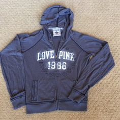 New Never Worn Zip Hoodie By Pink Small Super Soft And Stretchy Sporty Hooded Jacket With Letter Print, Sporty Long Sleeve Hooded Jacket With Letter Print, Casual Sports Hooded Jacket With Letter Print, Casual Hooded Jacket With Letter Print, Casual Long Sleeve Hooded Jacket With Letter Print, Casual Hooded Jacket With Letter Print For Fall, Casual Cotton Hooded Jacket With Letter Print, Fall Hooded Top With Logo Print, Casual Outerwear With Logo Print For Fall