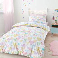 a child's bed with hearts on it