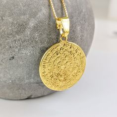 A gold disc of Phaestos charm necklace on a k14 solid gold chain. The ancient Greek calendar has hieroglyphics on both sides, in the form of a spiral, that have not yet been deciphered by archaeologists. K14 gold is used for the pendant and for the chain. A meaningful gift for a lover of historical artefacts. The actual disc is displayed in the museum of Herakleion on the Greek island of Crete. The gold necklace is delivered in a gift box. FREE  SHIPPING: Free international shipping with Fedex International Priority or DHL Express. Please provide a mobile phone number for delivery updates from shipping company. Carrier and tracking code are messaged to buyer once shipment is complete. All jewelry is shipped from our premises in Athens, Greece. GIFT WRAPPING: All jewelry is delivered in an Gold Medallion Necklace With Charms, Amulet Style Yellow Gold Medallion Necklace, Symbolic Engraved Medallion Necklace, Engraved Yellow Gold Coin Amulet Necklace, Engraved Yellow Gold Coin Necklace, Symbolic Gold-plated Medallion Necklace, Symbolic Gold-plated Coin Necklace, Symbolic Yellow Gold Coin Medallion Necklace, Symbolic Gold Plated Medallion Necklace