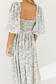 the search for the perfect all-season wedding guest dress is over. this stunning puff sleeve midi dress features a blue floral pattern + a flirty corset-inspired bodice. guaranteed to turn heads with every wear, it’s a must-have for cocktail parties, holiday dinners, or anytime you feel like frolicking. blue floral // midi length, scoop neckline, dramatic puff sleeves, back zipper closure, smocked bodice, fully lined model is 5'8" + wearing a small measurements are approximate + taken while layi Puff Sleeve Floral Dress With Smocked Bodice For Brunch, Puff Sleeve Dress With Sweetheart Neckline And Floral Print, Floral Puff Sleeve Dress With Gathered Sleeves For Brunch, Midi-length Puff Sleeve Dress For Garden Party, Midi Length Puff Sleeve Dress For Garden Party, Brunch Floral Print Midi Dress With Puff Sleeves, Puff Sleeve Midi Dress With Floral Print For Brunch, Puff Sleeve Floral Midi Dress For Brunch, Blue Floral Print Midi Dress With Puff Sleeves