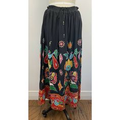 . New Deadstock Vintage Skirt From Rajasthan India . Black Heavy Cotton With Bright Multi Color Appliqus, Embroidery And Shisha Mirrors . Embroidery And Appliqus Show Birds, Flowers, And Abstract Shapes. Hand Done. See Reverse Of Skirt . Label States Size Large. Drawstring Waist So Adjustable From 26" Waist (Smallest) To 36" Waist (Largest) . Hips Measure 72" Free Size. . Shown On Size 6 Mannequin For Reference. . An Amazing, Happy, Ethnic, Boho, Heavyweight Skirt. . In New Condition Black Bohemian Maxi Skirt For Festival, Bohemian Black Maxi Skirt For Festival, Bohemian Multicolor Skirt With Floral Embroidery, Multicolor Bohemian Skirt With Floral Embroidery, Traditional Multicolor Spring Maxi Skirt, Traditional Multicolor Maxi Skirt For Spring, Black Floral Embroidered Skirt, Bohemian Embroidered Skirt For Vacation, Black Embroidered Flowy Skirt