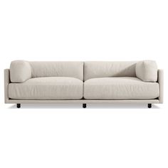 a gray couch with two pillows on it's back and one arm facing the camera