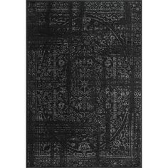 a black rug with an intricate design on the front and back side, it's dark