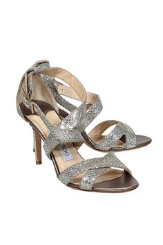 Sparkle and shine in these metallic Jimmy Choo strappy sandal heels! Featuring a glitzy design, they're the perfect match for any beaded cocktail dress or jazz up your skinny jeans with a touch of sparkle and a dazzling handbag! Size 6 (IT 36) Made in Italy Glitter-covered leather upper Strappy design with buckle closure Leather footbed Leather sole Heel 3.5" Sparkling Open Heel Sandals For Summer, Cocktail Sandals With Heel Strap For Party Season, Cocktail Party Heel Strap Sandals, Sparkling Sandals For Summer Night Out, Cocktail Party Sandals With Heel Strap, Sparkling Sandals For Night Out In Summer, Round Toe Embellished Sandals For Party Season, Embellished Round Toe Sandals For Party Season, Holiday High Heel Sandals