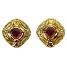 Wonderful pair of Estate Earrings signed Seidengang, featuring cabochon Rhodolite Garnets and faceted Iolite stones set in 18k gold; beautifully worked D-ended square mountings. Approx. size of each earring: 1.25 inches x 1.25 inches. Pierced clip systems. Classic and Timeless...To have, to Hold Heirloom Quality! Iolite Stone, Trend Jewelry, Rubellite Tourmaline, Indian Jewellery Design Earrings, Black Diamond Ring Engagement, Gold Jewelry Simple, Garnet Jewelry, Jewelry Design Earrings, Earrings Clip