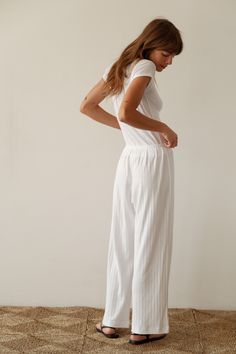 Our best-selling simple pant reimagined in a cropped silhouette. The Pointelle Simple Crop Pant is super-soft, effortless and versatile. Pairs perfectly with The Pointelle Sqaure Neck Tank and The Pointelle Baby Tee Made in LA Cropped Summer Bottoms For Daywear, Stretch Wide Leg Pants For Daywear, Relaxed Fit Ankle-length Culottes With Elastic Waistband, Stretch Cropped Bottoms For Loungewear, Wide-leg Elastic Waistband Culottes For Loungewear, Fitted Wide Leg Pants For Loungewear, Wide-leg Culottes With Elastic Waistband For Loungewear, Elastic Wide-leg Culottes For Loungewear, High-waisted Wide Leg Pants With Elastic Waistband